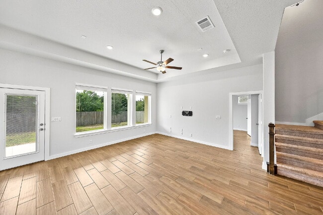 Building Photo - Greenbelt. 3 Car Garage. Built In Dog Room.