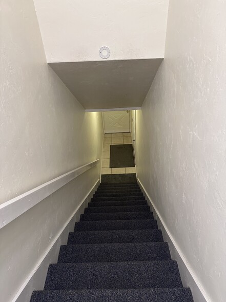 Stairs to carriage level townhome from the garage - 1337 Airport Dr