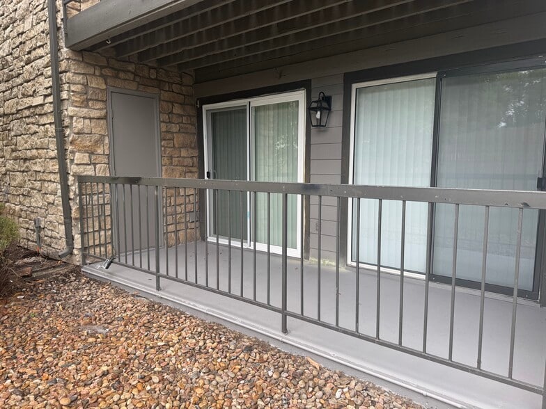 Patio with storage closet and separate entrances to primary bedroom and living room - 2575 S Syracuse Way