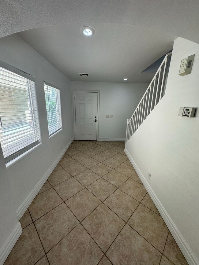 Building Photo - STUNNING 2 STORY HOME IN A GUARD GATED COM...