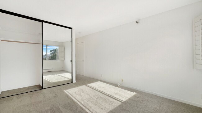 Building Photo - Exceptional Corner Unit w/ Wraparound Sout...