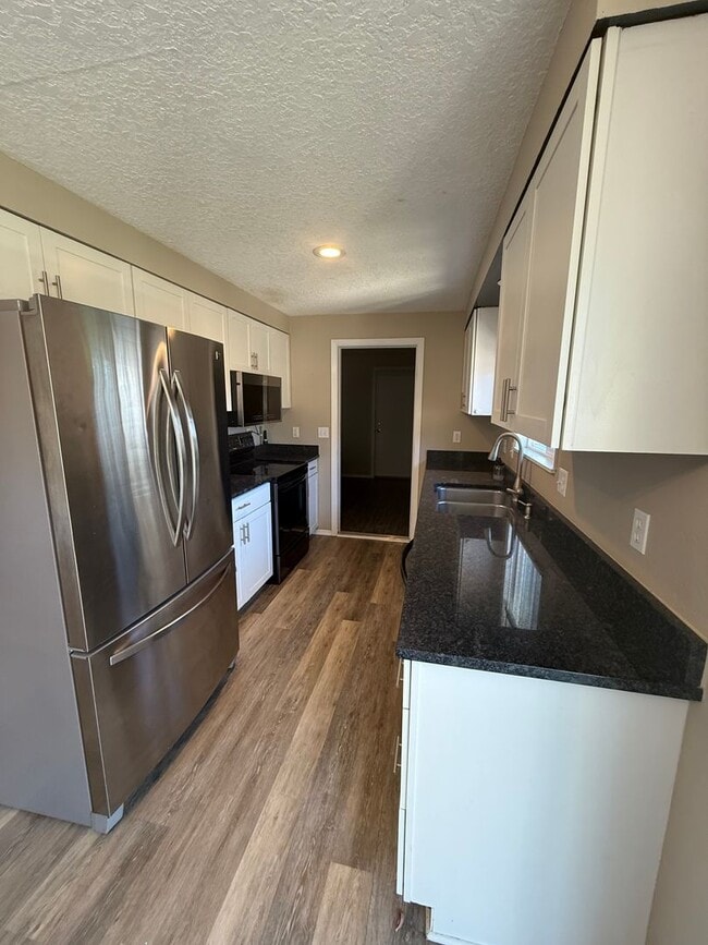 Building Photo - Updated 3+ Bedroom 2 Bath House with Large Fenced In Yard