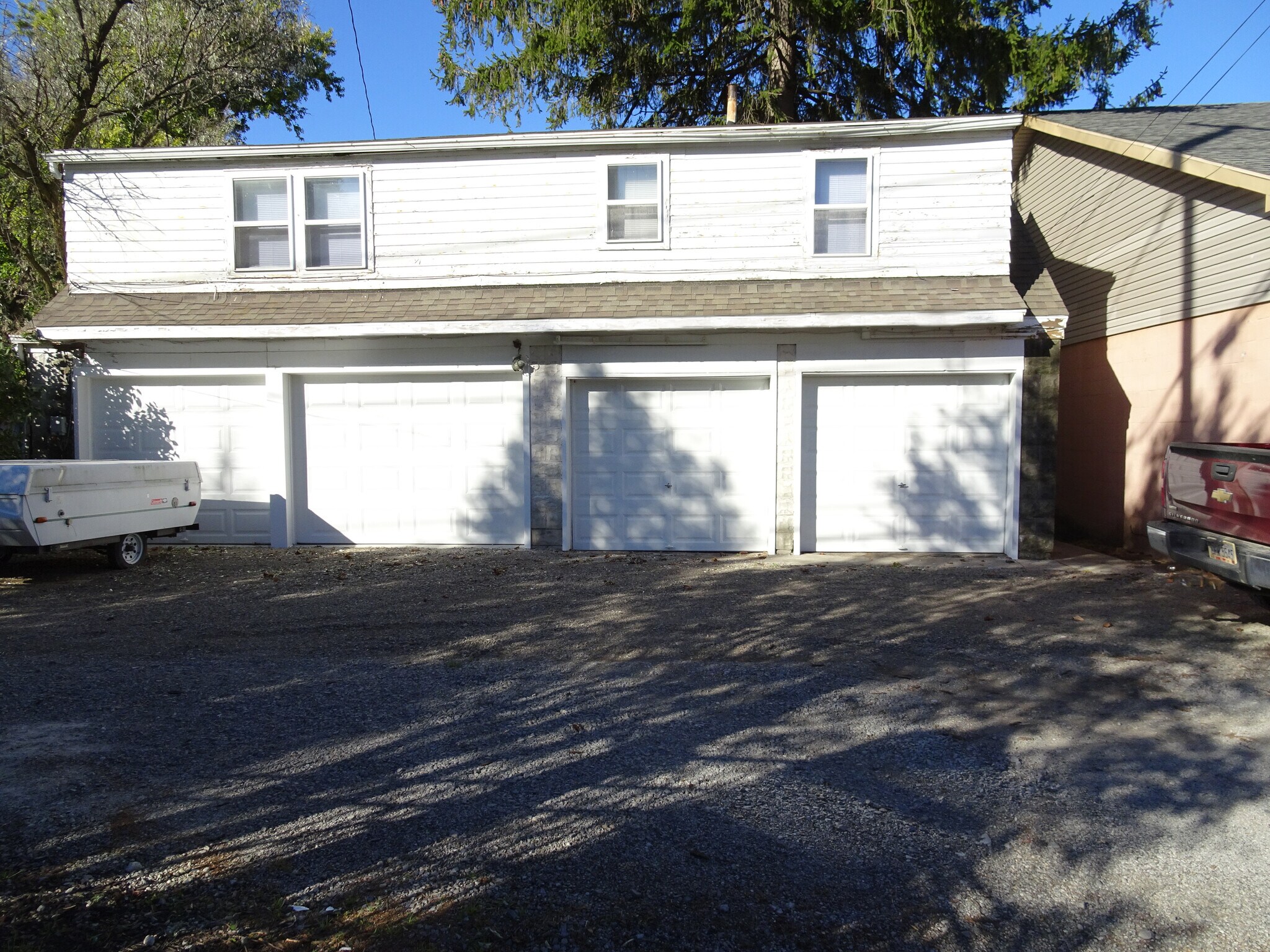 single family home is located above the garage - 833 S Cory St