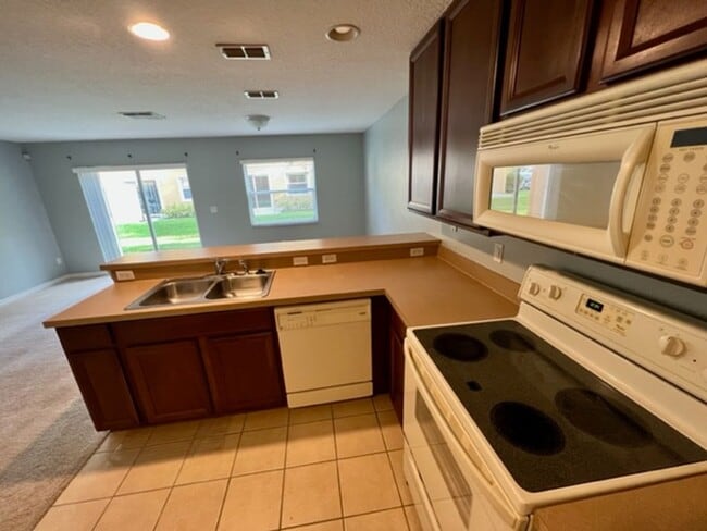 Building Photo - AVAILABLE NOW! Charming 2 Beds 2.5 Bath Townhome! 2 MASTER SUITES! Attached one car garage!! Extr...