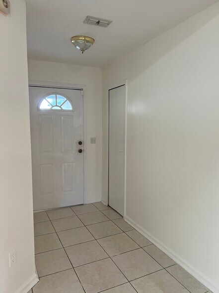 Welcoming main entrance with a side closet, perfect for storing coats, shoes, and everyday essential - 5374 Lacy Jane Way