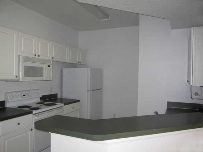 Building Photo - Unbeatable Value! 1BR Condo in Gated Palms Club – Pool, Gym & More!