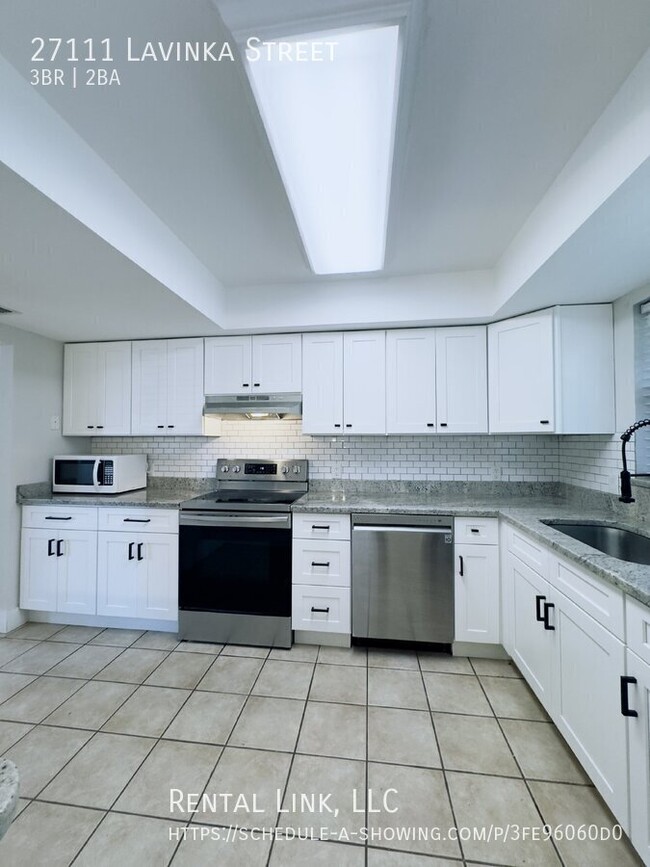 Building Photo - Newly updated home with a modern kitchen, ...