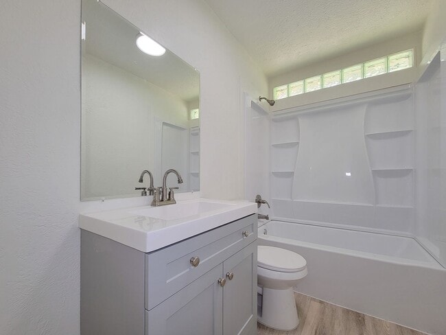 Building Photo - REMODELED 4 BEDROOM 2 BATH LEASE HOME IN A...