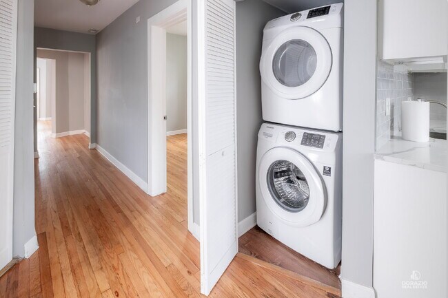 Building Photo - Modern 4BR Apartment with Hardwood Floors, Balcony & Central A/C