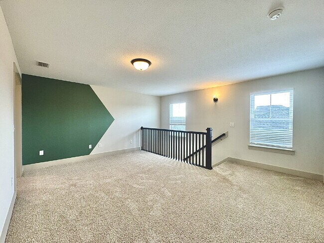 Building Photo - Need Space?  How about 5 bedrooms, 2.5 baths + an extra bonus area upstairs so that the kids can ...