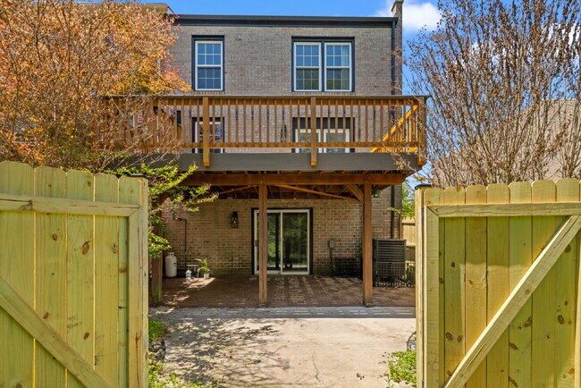Building Photo - Completely Renovated Corner Townhome with Modern Kitchen, Designer Baths, and Private Yard
