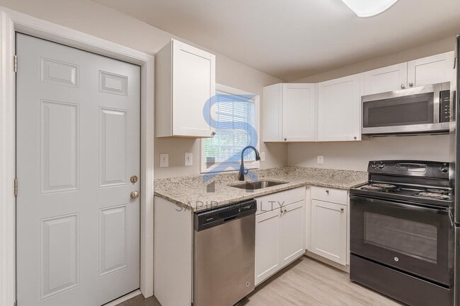 Building Photo - LIMITED-TIME OFFER! Apply today with NO APPLICATION FEE! Terms apply. Call (678) 487-7896, Option...