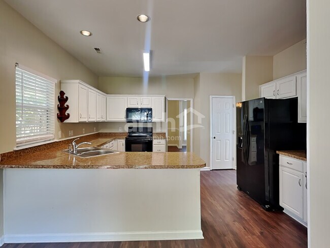 Building Photo - 8638 Flowers Court