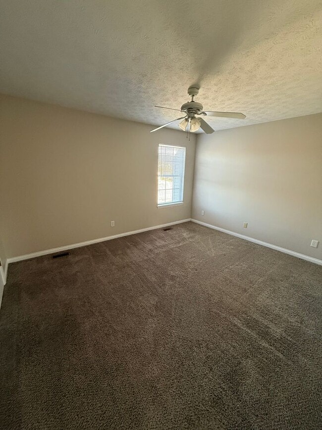 Building Photo - 2-bedroom, 1.5-bath townhouse with an attached garage