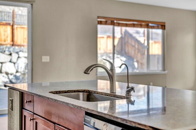 Building Photo - Sun-Filled, Spacious Living with a Three-Car Garage