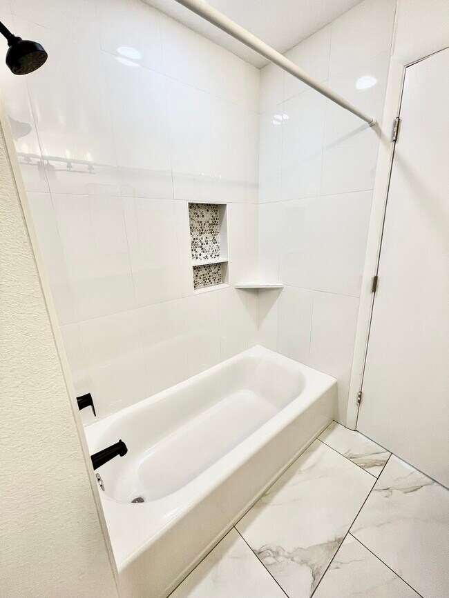 HALL BATH HAS BRAND NEW TUB AND TILE - 42 W 6th Pl