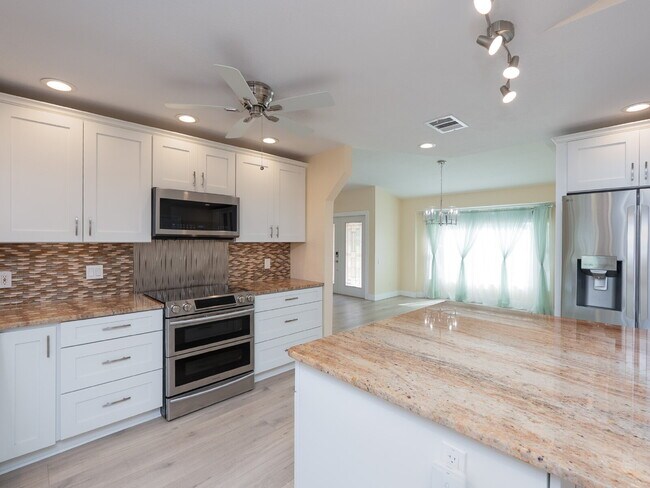 Building Photo - 3 BEDROOM • 2 BATHROOM • PRIVATE POOL • WATERFRONT • BOAT LIFT • ZERO DEPOSIT MOVE-IN AVAILABLE
