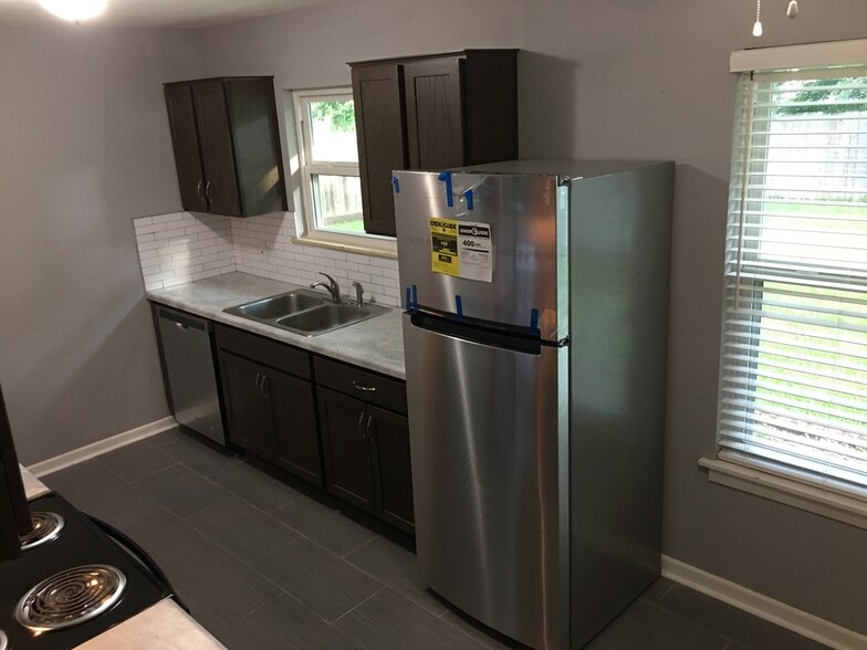 Refrigerator-side sink and cabinets - 230 Middlebury Dr.