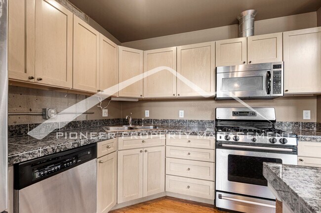 Building Photo - Modern Industrial Condo Downtown with Park...