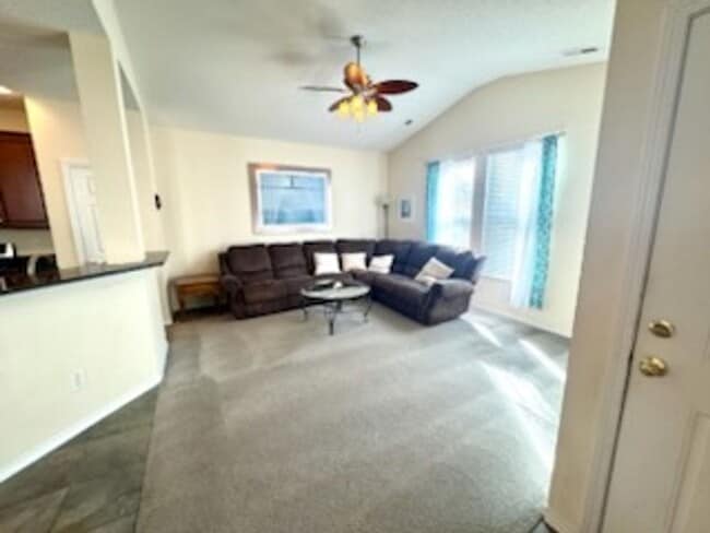 Building Photo - Relax and Unwind in this Spacious End-Unit...