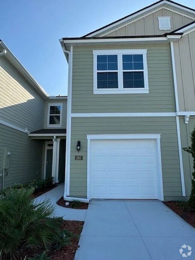 Building Photo - Serene Pond-View Townhouse in Palm Coast: ...