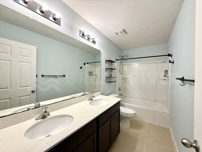 Building Photo - Room to Live, Space to Thrive! Stunning 6BR Home with Solar, Upgrades & Screened Lanai in Macclen...