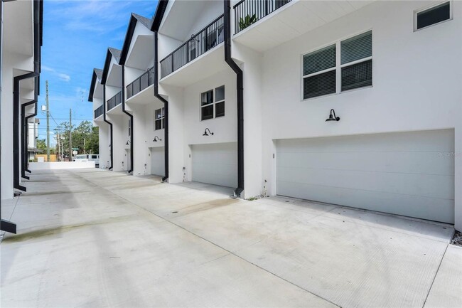 Building Photo - Available Now: 3-story townhome new constr...