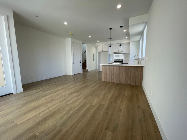 Building Photo - JUST COMPLETED MODERN TOWNHOMES! Never Liv...