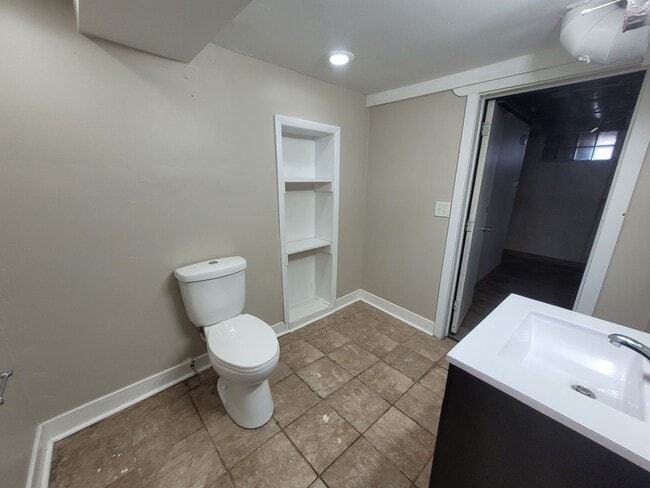 Building Photo - Four bedroom home on Indianola Ave with large yard and two decks!