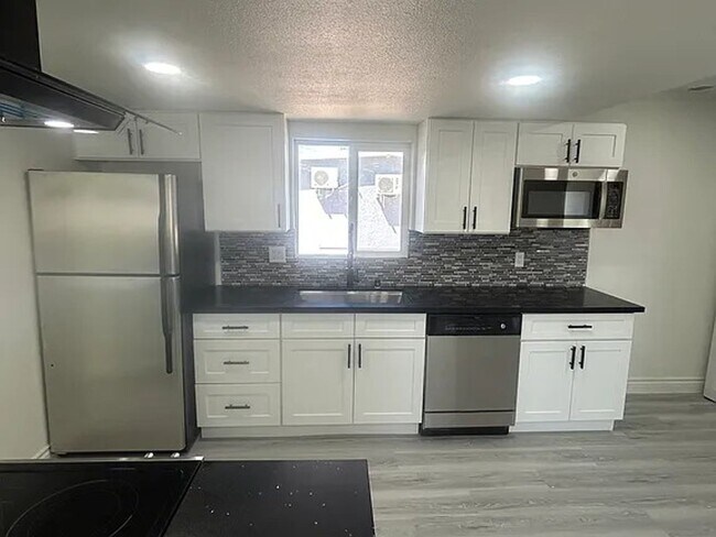 Building Photo - Modern Living! All-New Remodel with LED Li...