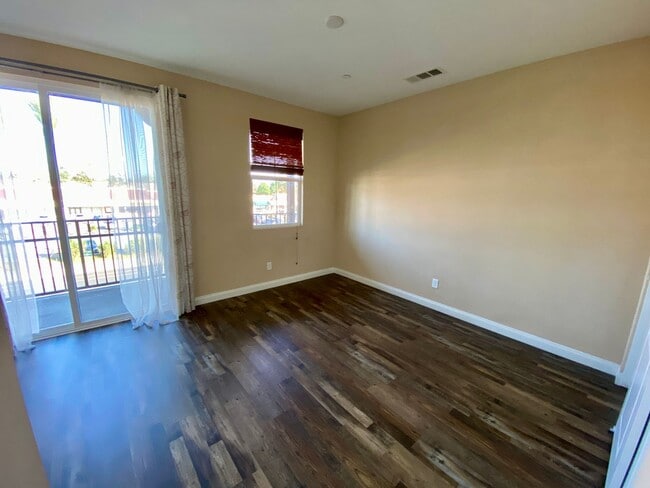 Building Photo - Stylish 3-Story Townhome with Balconies & Open-Concept Living