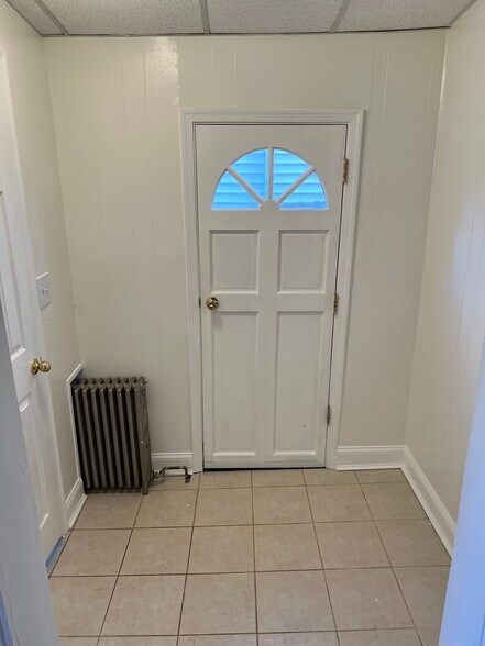 The mudroom connects to the kitchen and half bathroom on the first floor. - 126 Merion Ave