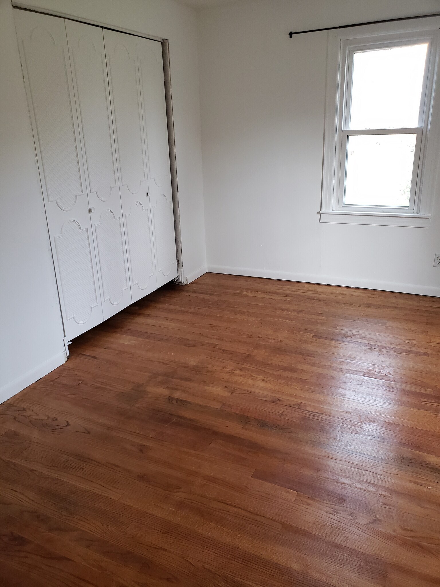 Large closet with shelf above rod extends past closet doors. - 10106 Wingfield Rd
