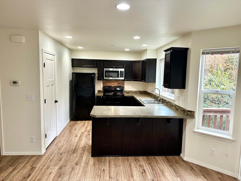 Large kitchen with full size pantry. - 1747 Vela Ln SW