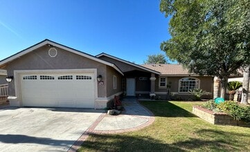 Building Photo - Take a look at this charming single family...