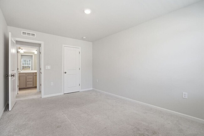 Building Photo - Upgraded 3BR Townhome in Wake Forest | Open Layout, Garage & Resort-Style Amenities