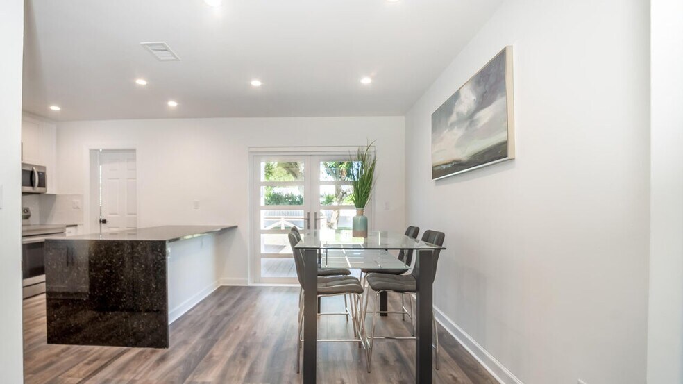 Living room facing towards dining area. - 121 George Bush Blvd