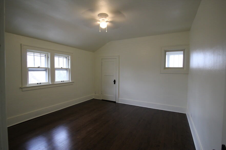 Bedroom 1 with large closet and ceiling fan - 1932 S 83rd St