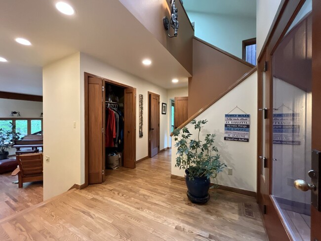 Building Photo - One-of-a-Kind Custom Home with Wall of Windows, Stone Fireplaces, Expansive Entertainment Space &...
