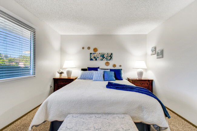 Master bedroom offers a king size bed and nightstands with lots of storage. - 12414 W Nugget Ct