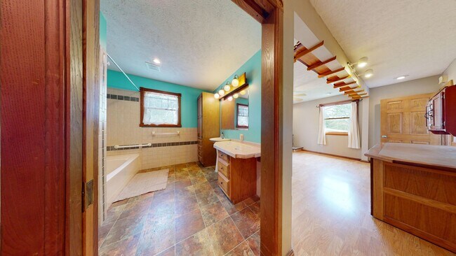 Building Photo - Country living! 1st floor laundry 3+ car garage with work shop