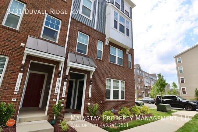 Building Photo - 2 Bedroom Plus DEN End Unit Townhome W Gar...
