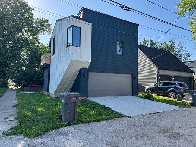 Building Photo - Vaulted Ceilings & Hardwood Floors in This Charming Indianapolis L