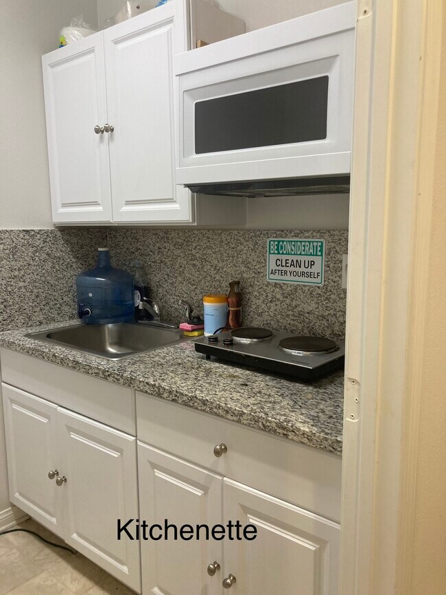 Kitchen with granite, cooktop microwave and full size fridge - 24734 Silver Stone Ct