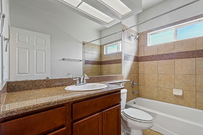 Building Photo - "Spacious 4-Bed Oasis with Granite Touches...
