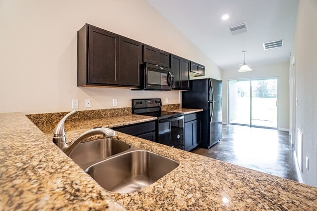 Building Photo - MOVE IN SPECIAL- Beautiful 3/2 Energy Effi...