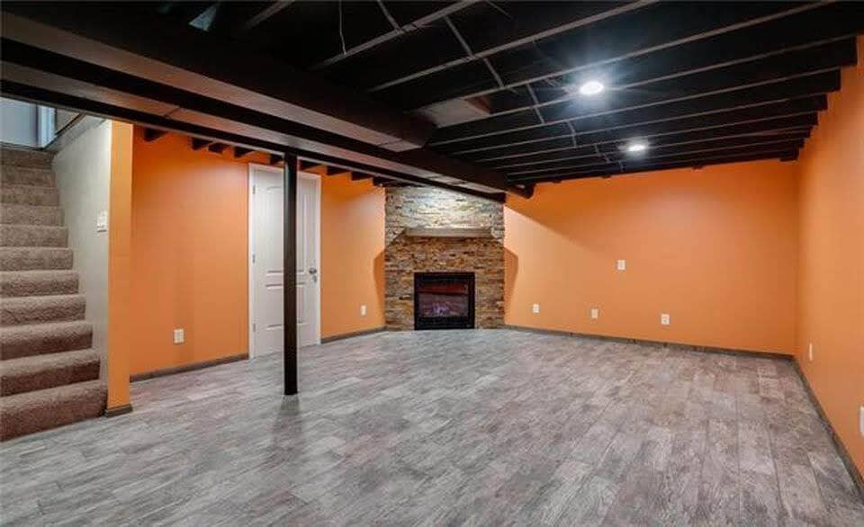 The large basement area/ family room newly remodeled, includes a gas fireplace. - 7416 N. Central St.