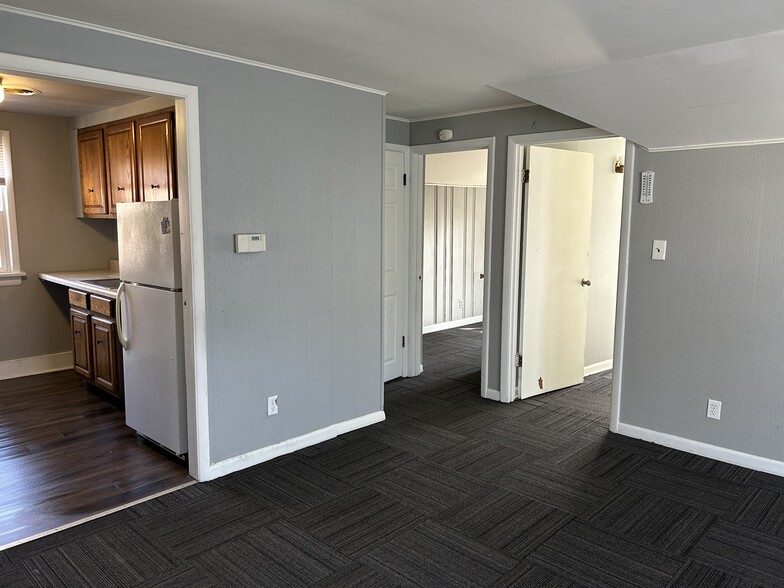 Living room looking towards the kitchen and the rear small extra room, - 1012 W Armstrong Ave