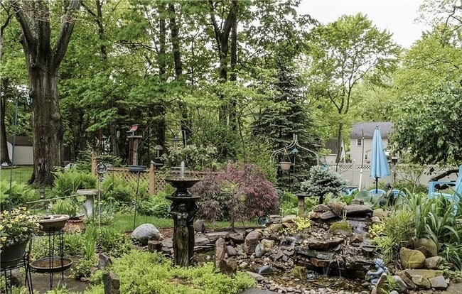 Building Photo - Storybook Bungalow with Beautiful Grounds