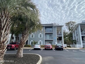 Building Photo - FULLY FURNISHED CONDO in sought-after Sea Trail subdivision!